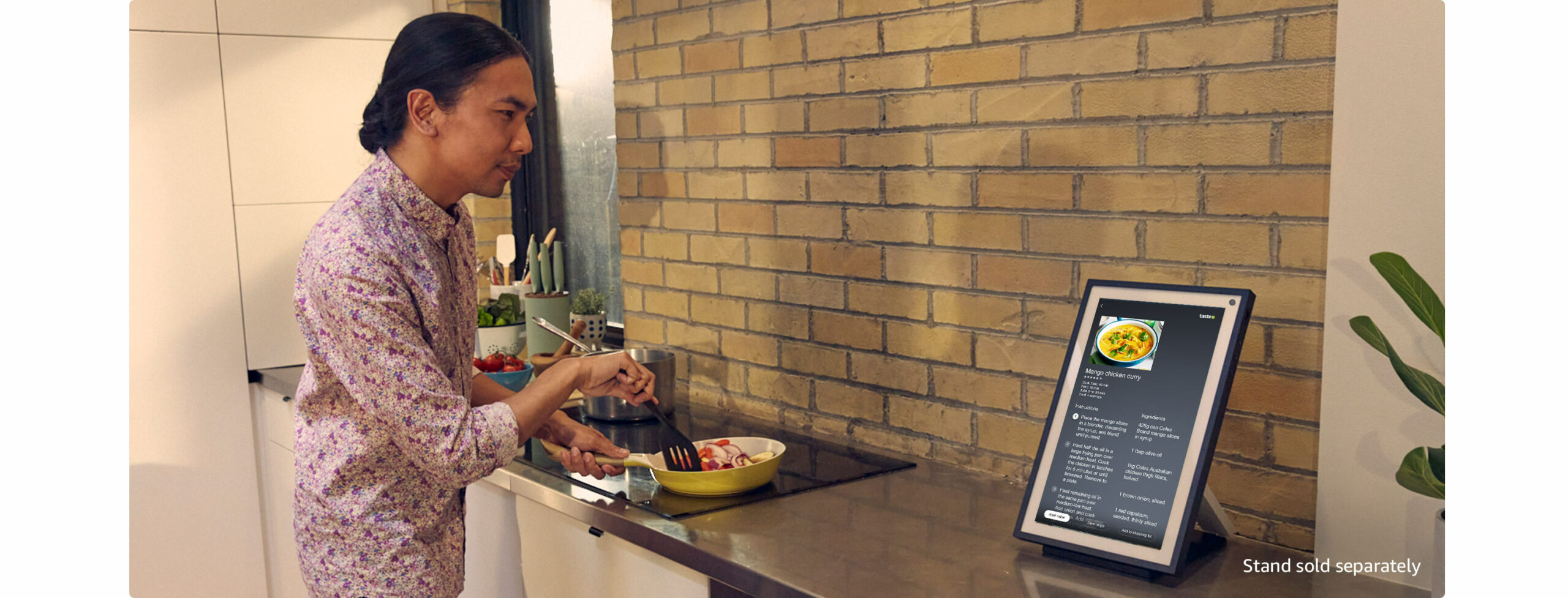 Person using Alexa Show in kitchen