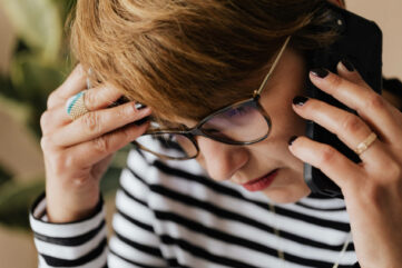 Anxious woman on phone - Optus Call Stop